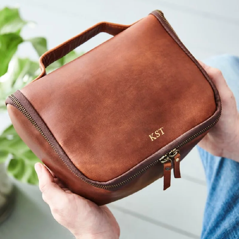 Vintage leather travel bag with brass accents for a classic and sophisticated lookLeather Luxe Wash Bag with Handle