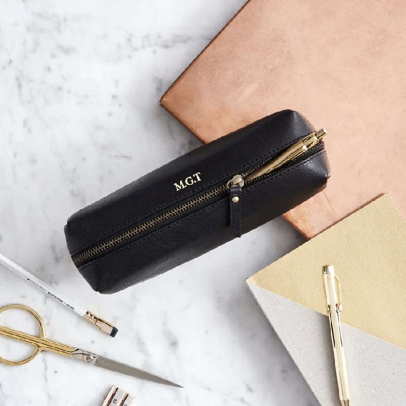 Vintage leather travel bag with brass accents for a classic and sophisticated lookLeather Pencil Case With Personalisation