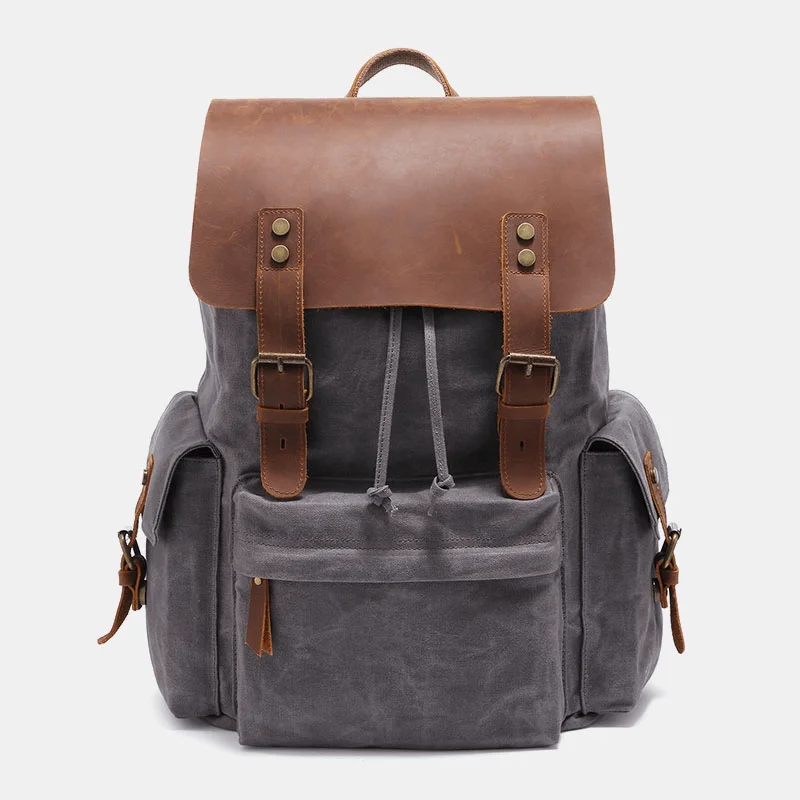 Men's leather backpack with vintage-style brass hardware for business useMen Canvas Genuine Leather Cowhide Retro Large Capacity 14 Inch Laptop Bag Waterproof Backpack