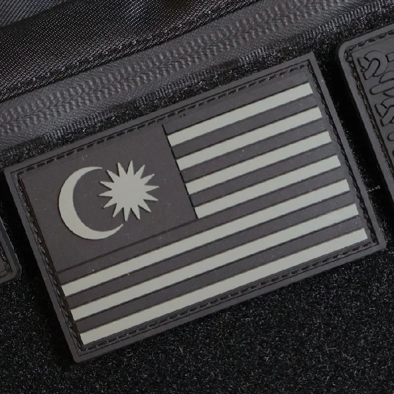 Travel bag with a built - in power bank charger for on - the - go device chargingThe Meniacc Malaysia Flag PVC Velcro Patch - Colour/BW