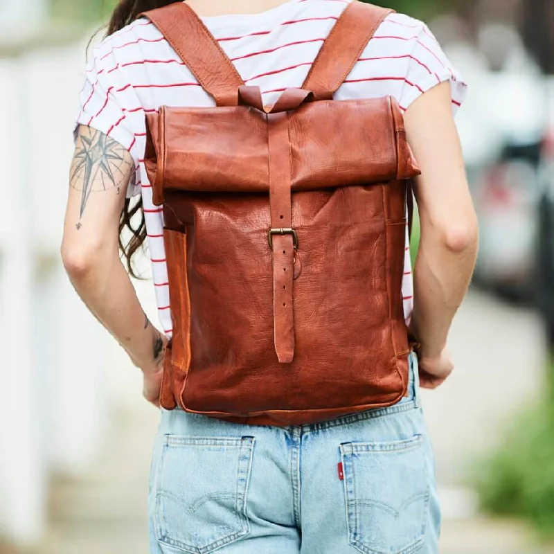 Foldable fabric travel bag for convenient storage when not in useRoll-top Leather Backpack