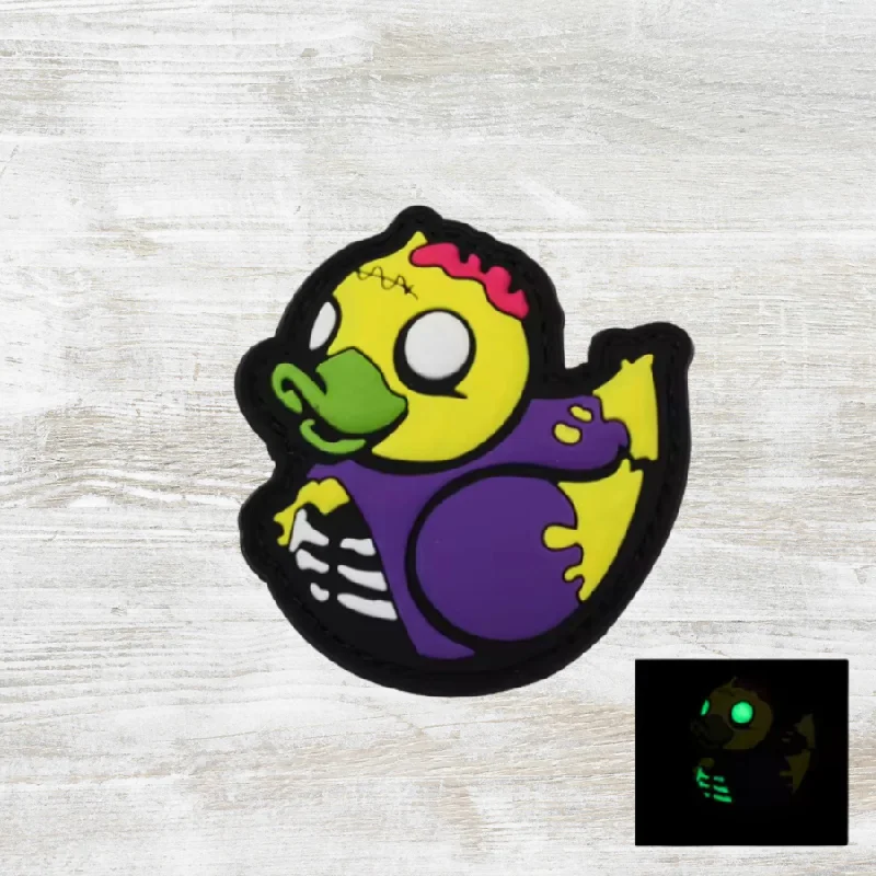 Travel bag with a built - in power bank charger for on - the - go device chargingThe Meniacc Zombie Ducky PVC Velcro Patch