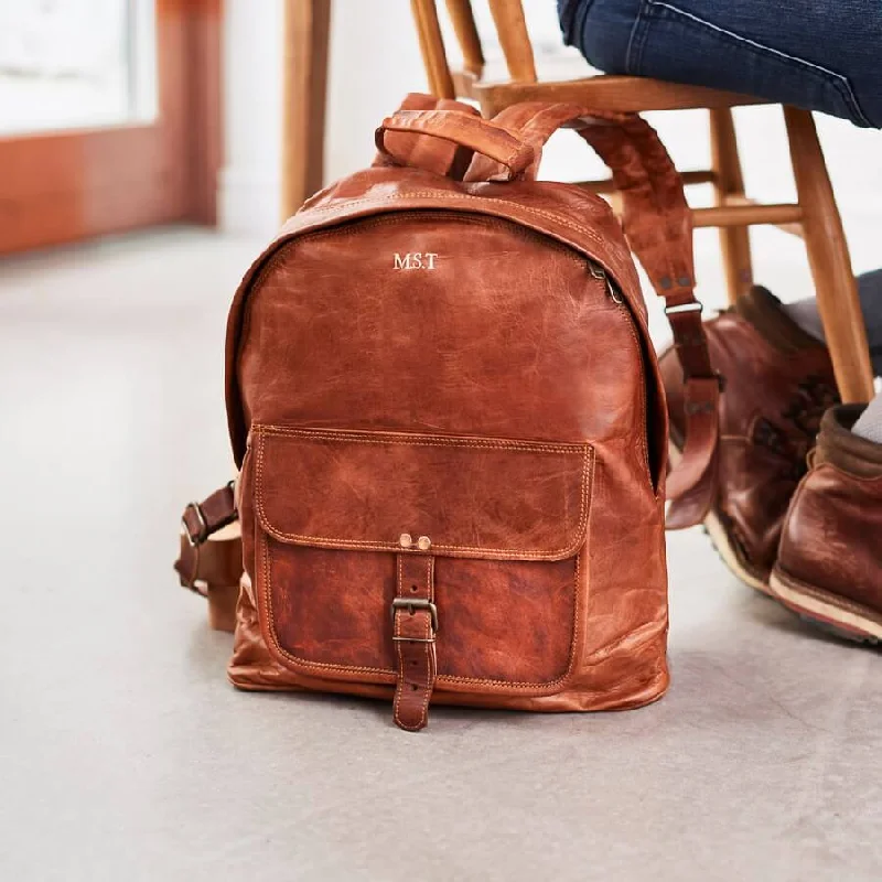 Vintage leather travel bag with brass accents for a classic and sophisticated lookZip Round Leather Backpack